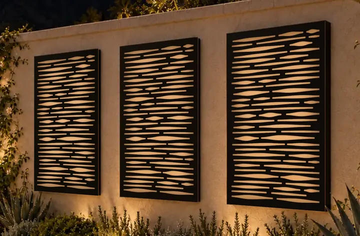 Strata, a concept screen shown on three frames on a garden wall after dark